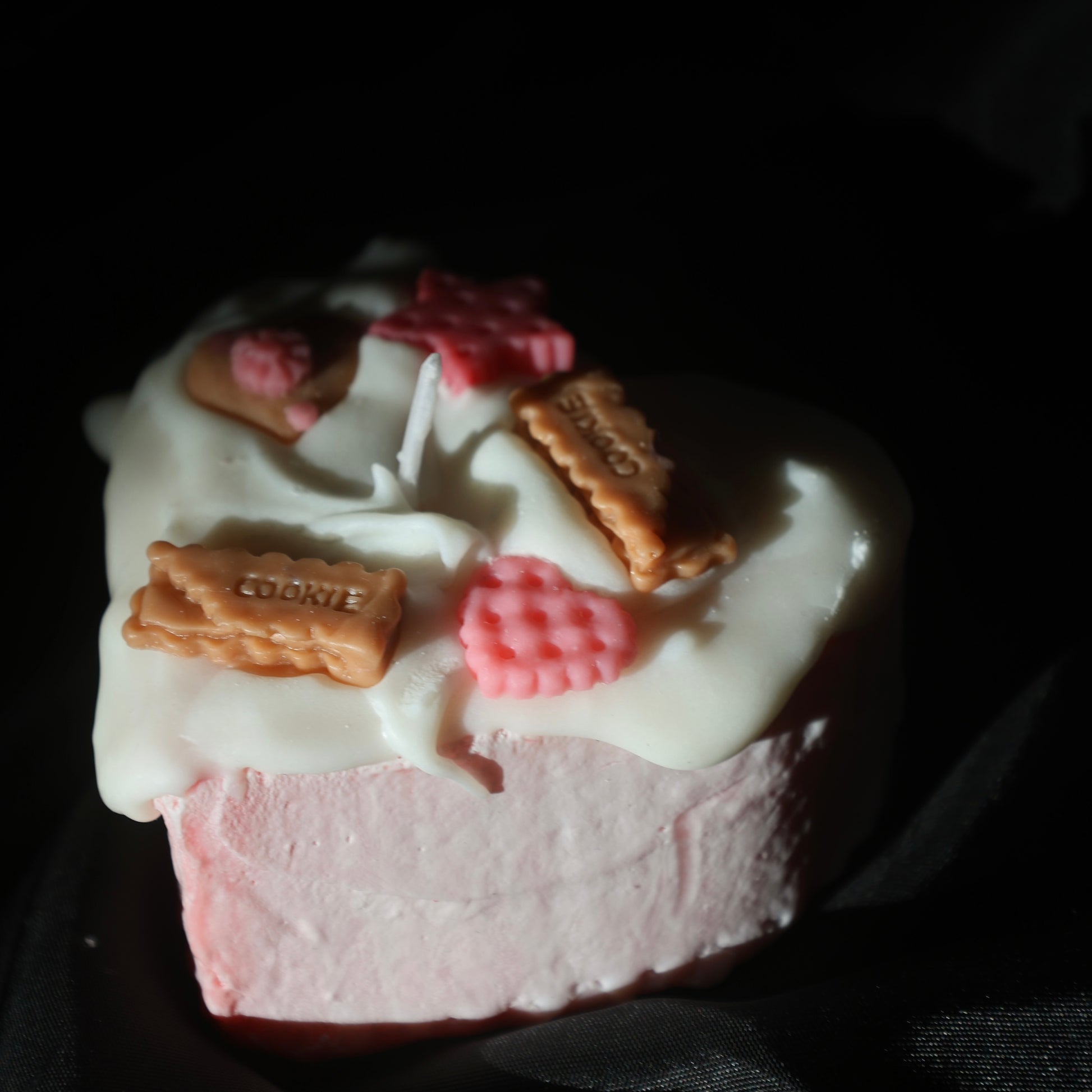 Cute dessert-style heart candle with pink and beige cookie accents by Lily Glow Home Decor