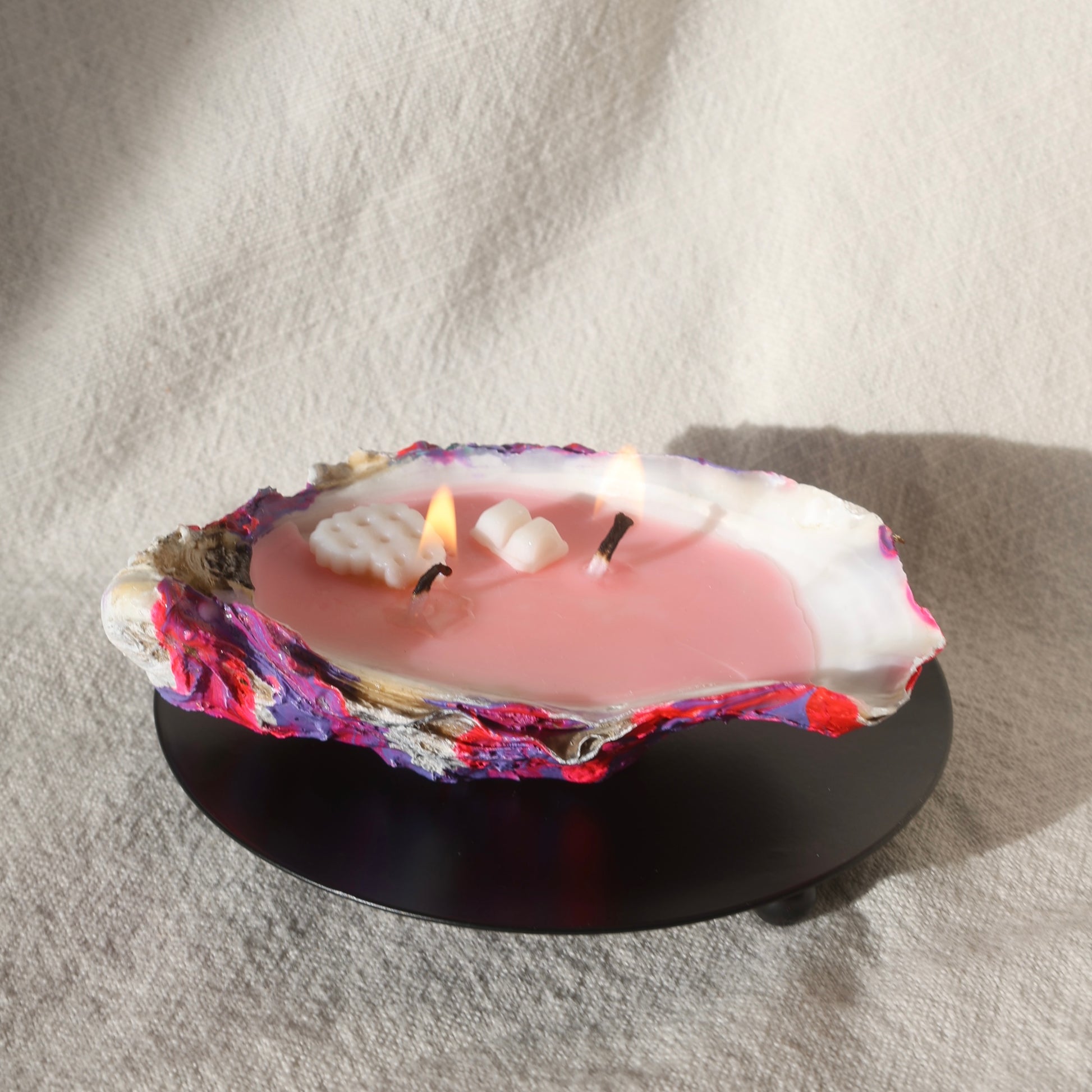 Round black candleholder with seashell candle by Lily Glow Home Decor