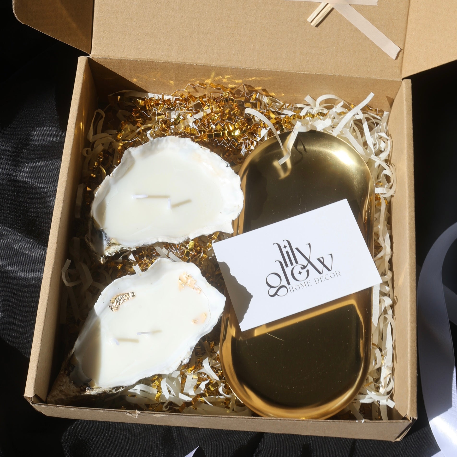 Gift box with two seashell candles and a golden candleholder from Lily Glow Home Decor