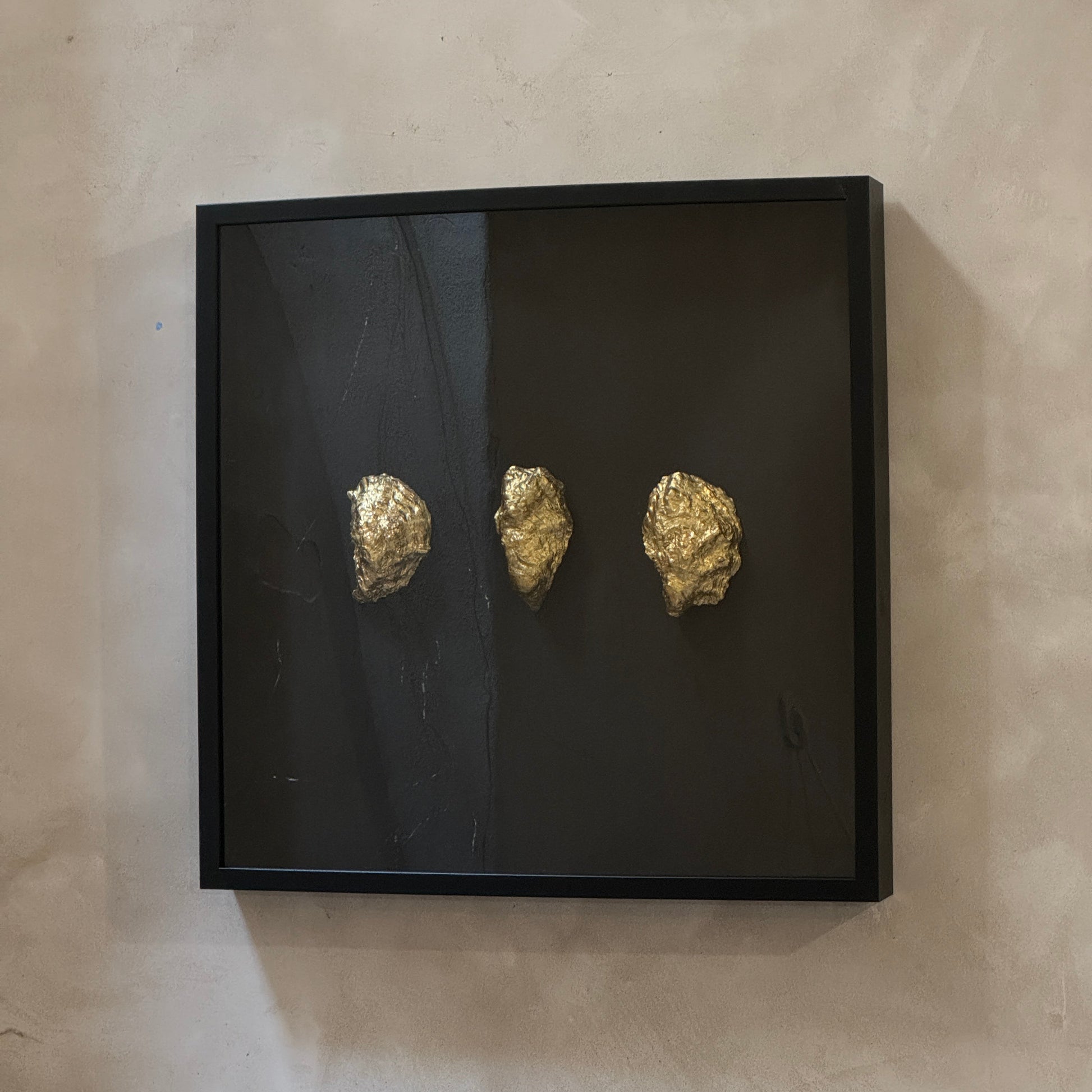 Three gold oyster shells framed on black background – Lily Glow Home Decor