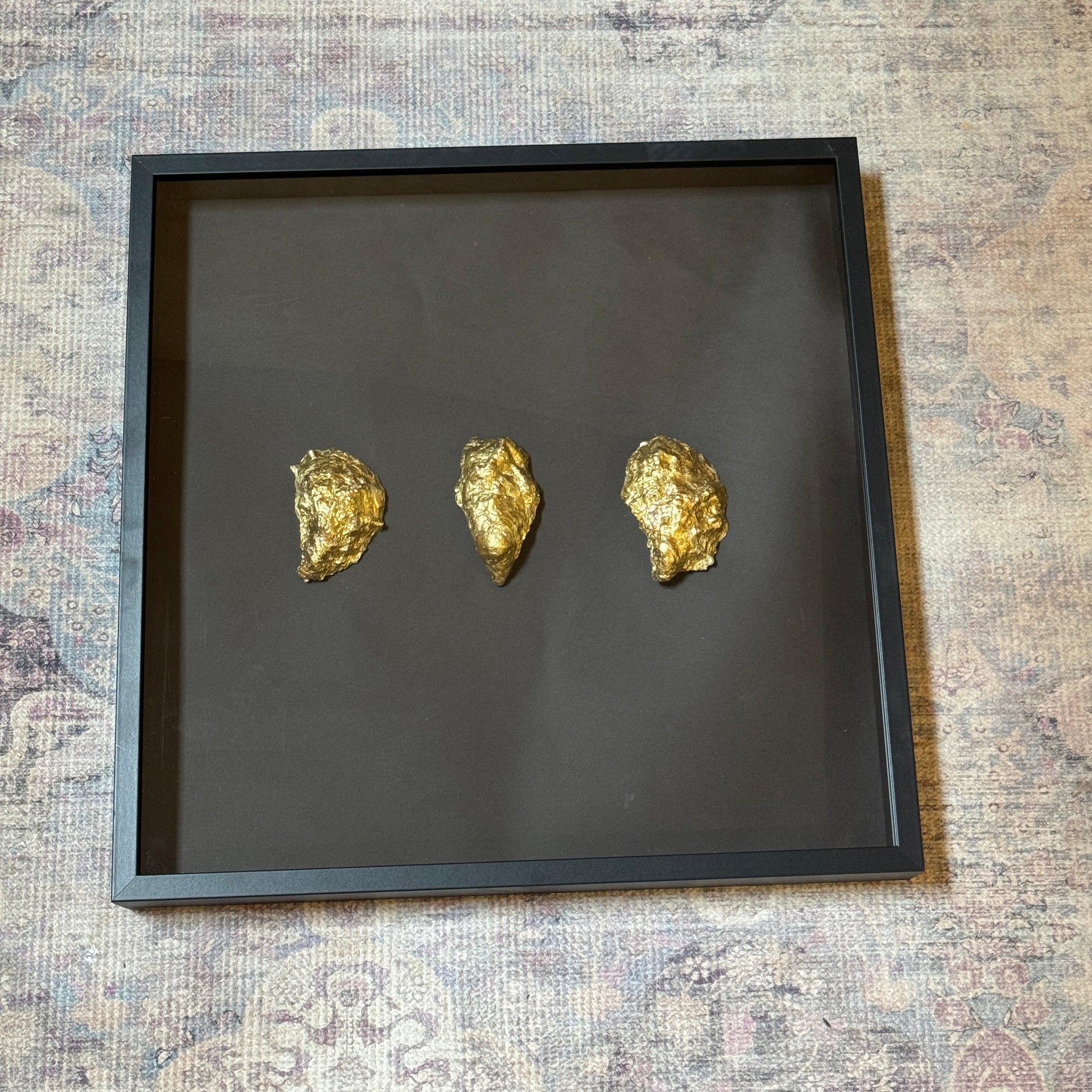 Three gold oyster shells framed on black background – Lily Glow Home Decor