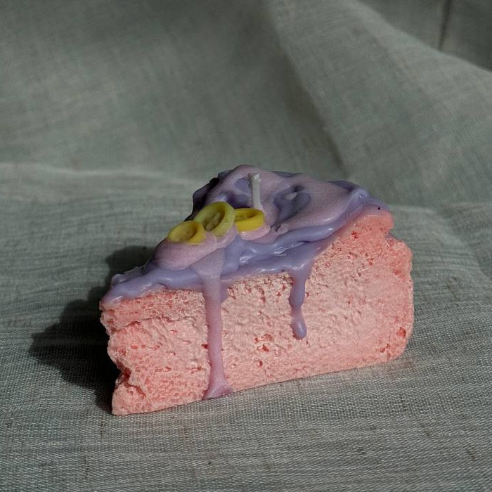 Whimsical cake slice candle in pink and purple colors by Lily Glow Home Decor