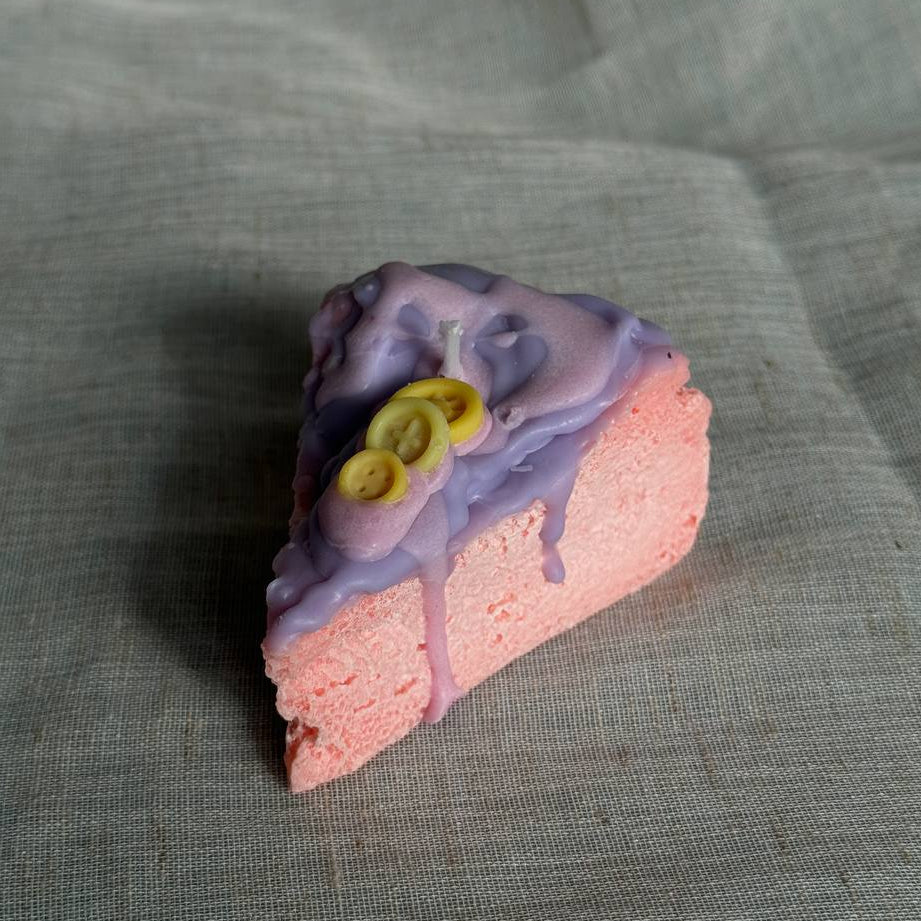 Whimsical cake slice candle in pink and purple colors by Lily Glow Home Decor