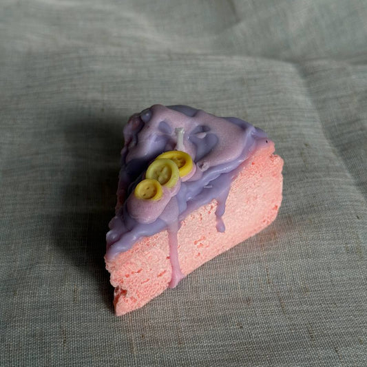 Whimsical cake slice candle in pink and purple colors by Lily Glow Home Decor
