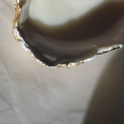 Seashell candle with a heart