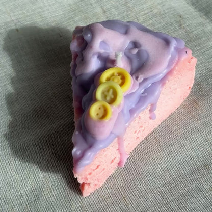 Whimsical cake slice candle in pink and purple colors by Lily Glow Home Decor